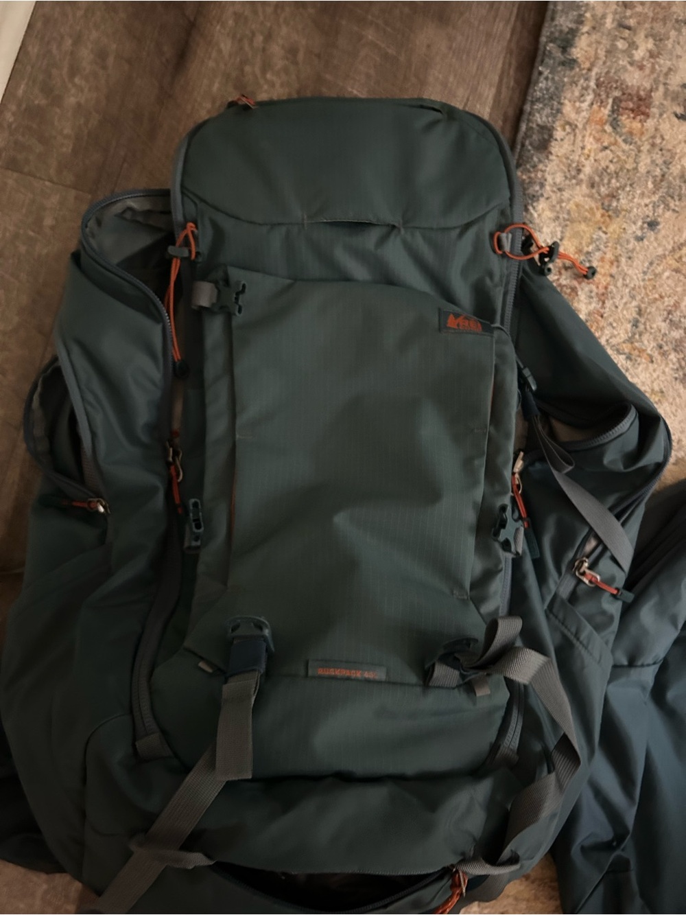 REI Dark Green Men's Technical Backpack with Orange Accents